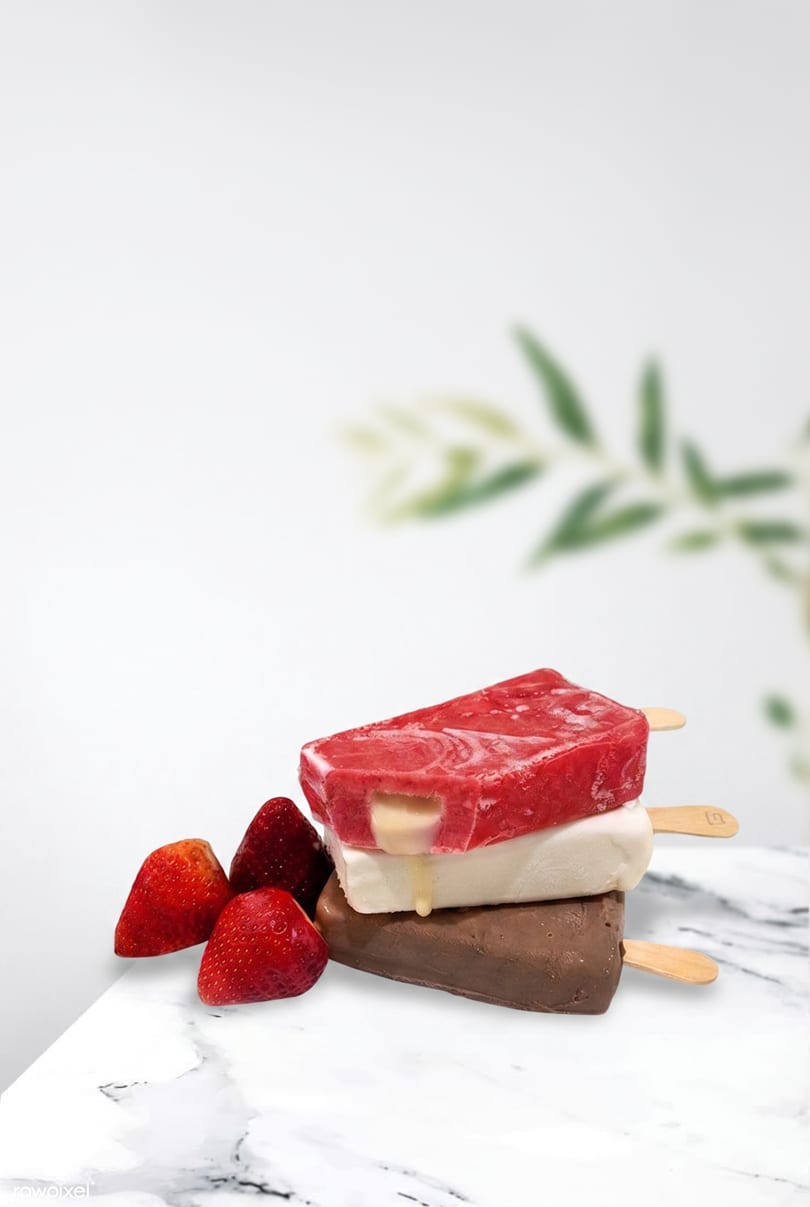 Stacked strawberry, vanilla, and chocolate popsicles with fresh strawberries on a marble surface.